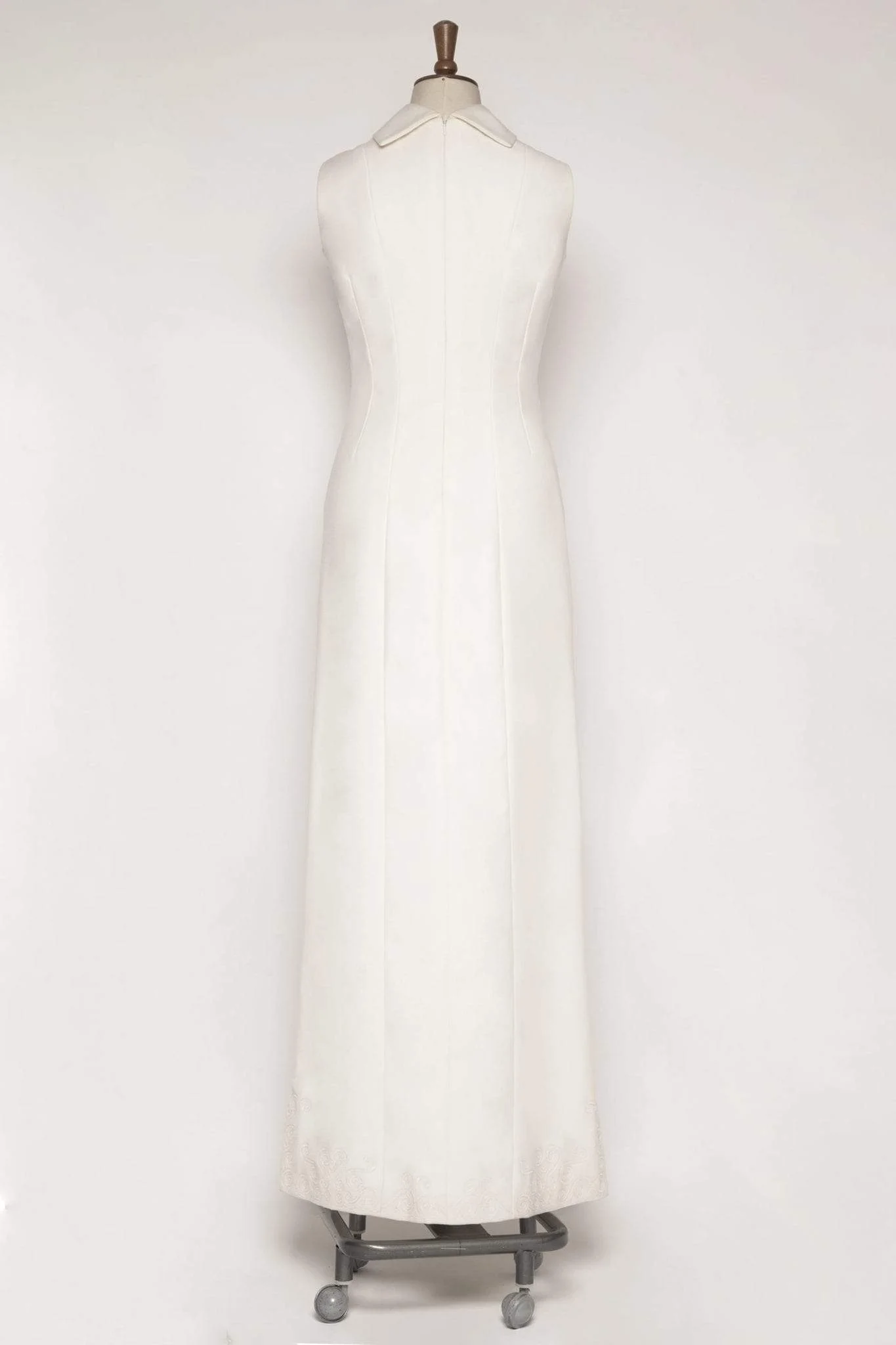 Back view of ivory cashmere tailored A-line dress, size 10, showing invisible zip and embroidered hem
