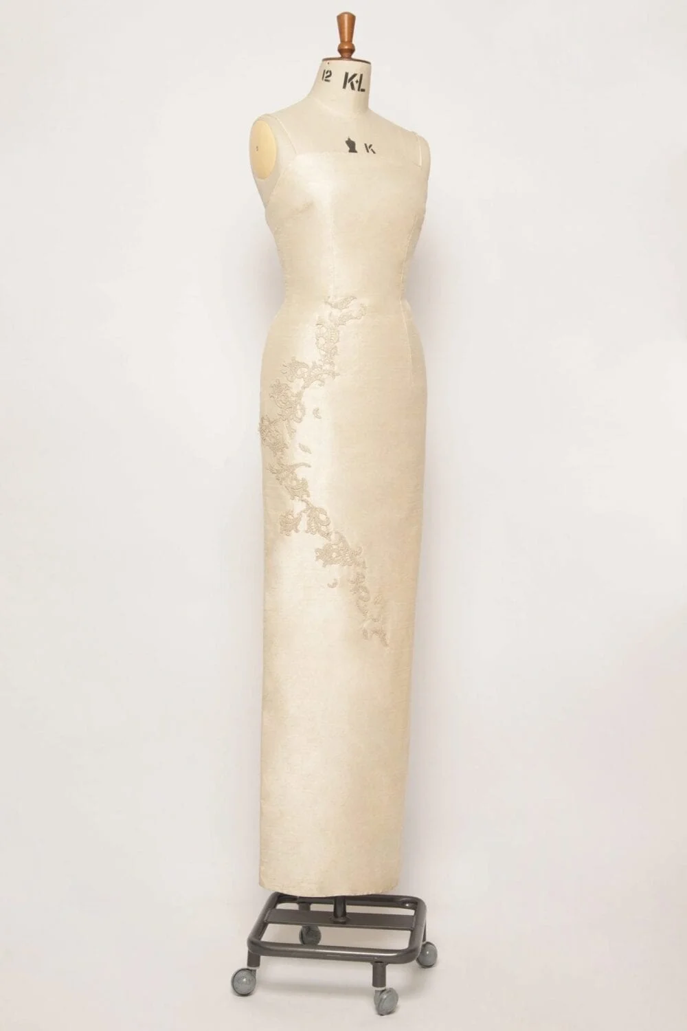 Elegant gold pure silk column dress with a square neckline, piped edges, spaghetti straps, and hand-sewn gold lace embroidery