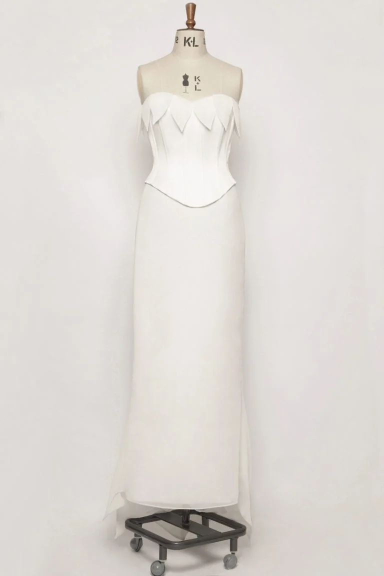 Daffodil chiffon corset wedding dress front view on mannequin showing satin basque bodice and leaf detail