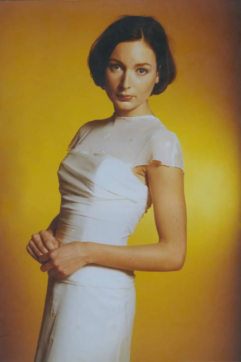 Long flowing ruched chiffon a line dress. A simple elegant floaty gown featuring a sheer overlay top, rouching and a drop down waist. The flowing silk chiffon & subtle embroidery give this dress a soft, delicate and romantic feel.