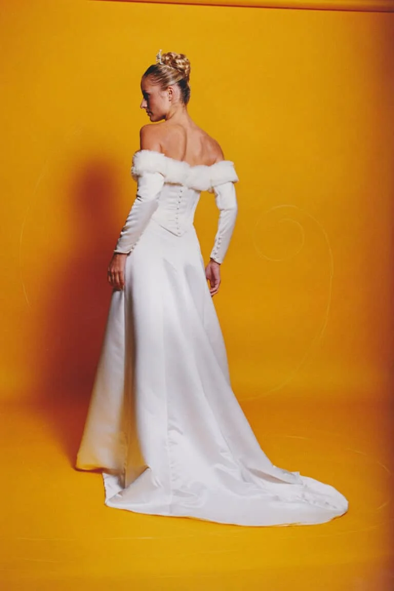 Bells of Ireland winter wedding gown back view on model showing cathedral train and button detail