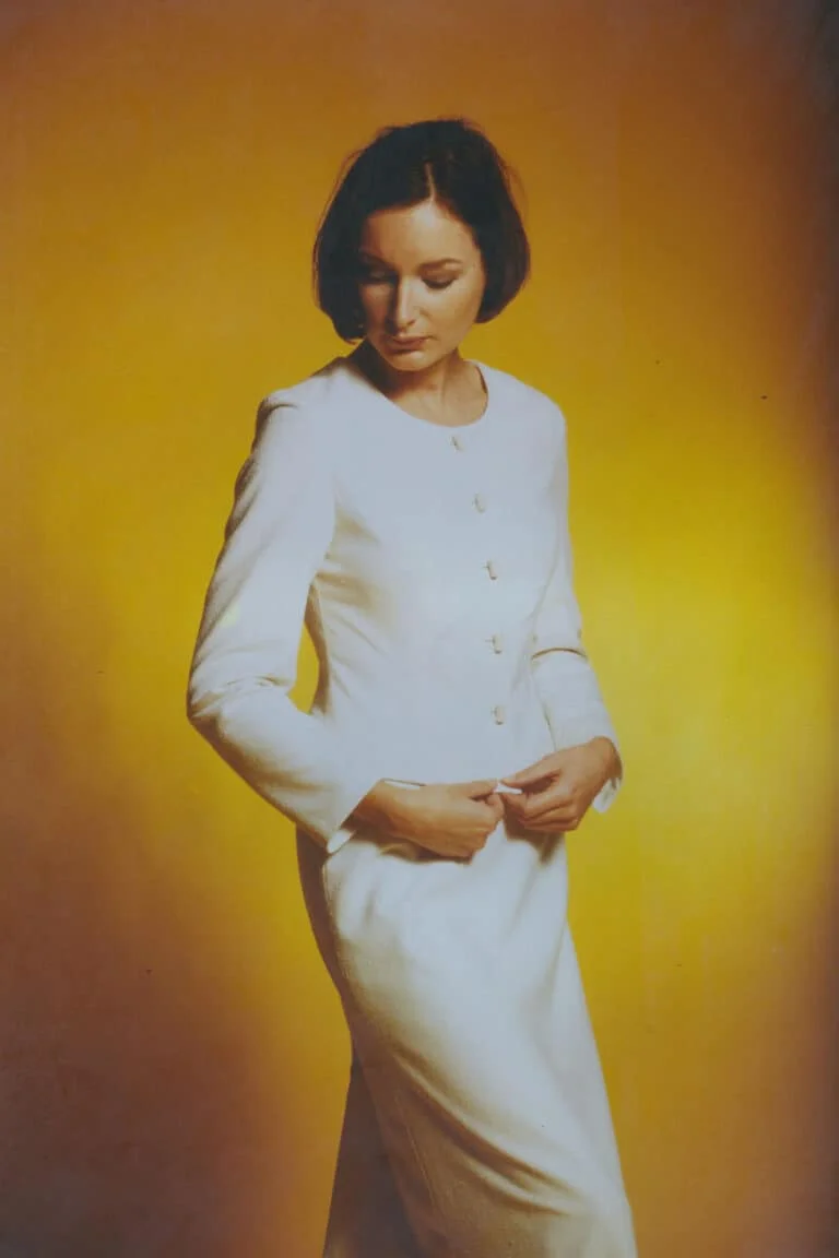 Classic two-piece ivory silk suit with a fitted short jacket and flowing A-line skirt in silk noil poplin