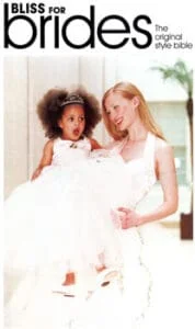 Bliss for brides mag - Fairytale Peach duchess satin halter gown with sweetheart bodice, full tulle skirt, piped edges, and covered buttons and matching bridesmaid dress.